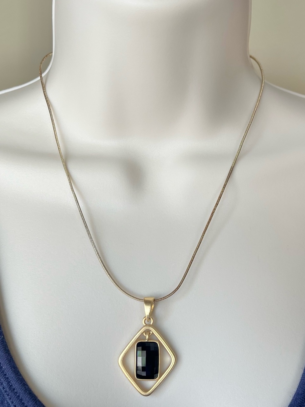 Lia Sophia Black and Gold Geometric Pendant Necklace